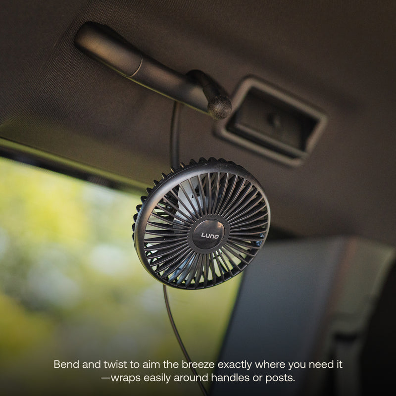 The Luno® Camping Fan, a compact black USB-C powered fan, attaches to your car's ceiling handle with a flexible arm for 360° airflow—ideal for car camping. Bottom text highlights its adjustable, wrap-around design.