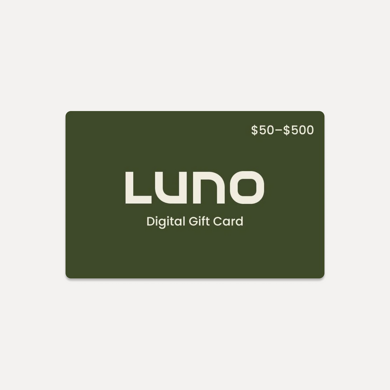 A digital gift card featuring a dark green background displays the text "Luno® Gift Card" in the center, with a value range of "$50 - $500" noted in the top right corner. Additionally, it has no expiration date.
