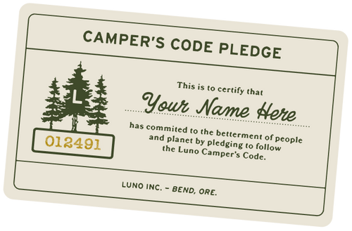 Illustration of a certificate titled "Camper's Code Pledge" with a serial number 012491, and a placeholder for "Your Name Here." The certificate is issued by Luno Inc. in Bend, Ore. It certifies a commitment to the betterment of people and the planet.