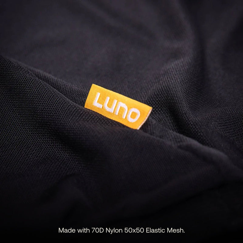 Close-up of a black fabric in excellent condition featuring an orange "Luno HQ" tag. The material, composed of 70D Nylon 50x50 Elastic Mesh, offers the durability akin to that found in high-end Car Window Screens (Pre-Owned).