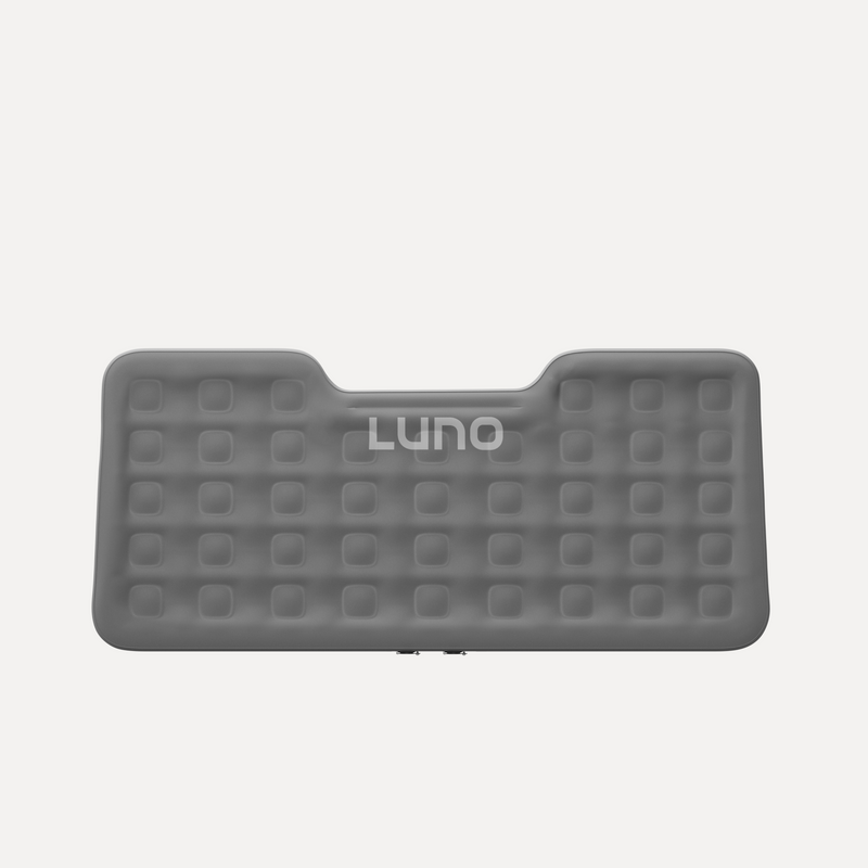 A gray inflatable mattress with square-shaped indentations and the brand name "LUNO" printed in white near the top center. The mattress has a unique shape with a cut-out at the top, giving it a distinctive appearance.