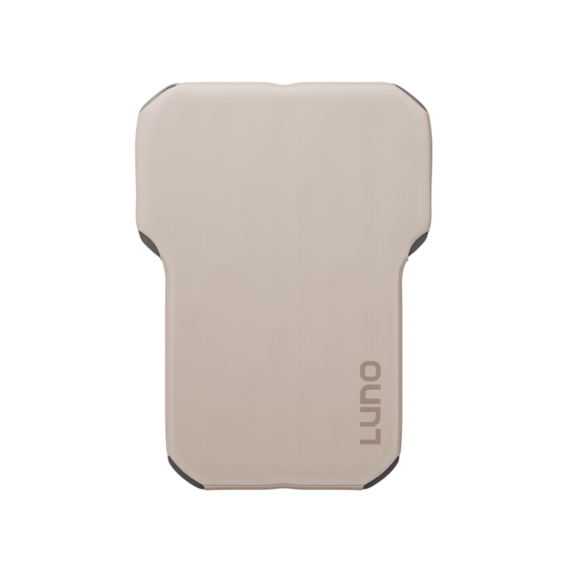 A beige inflatable sleeping pad with rounded corners and the word "LUNO" printed in gray on the lower right corner. The pad is rectangular with slight contours on the sides, designed for portability and comfort during outdoor activities or camping.