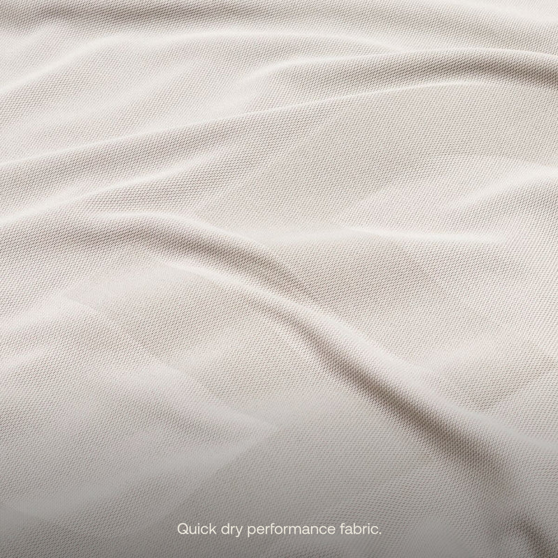 Close-up of a light-colored, textured fabric with visible ripples and folds. The fabric appears smooth and lightweight, ideal as a breathable fitted mattress sheet. The text at the bottom reads: "Quick dry performance fabric." Product Name: Fitted Mattress Sheet - AIR+FOAM Pro Camping Mattress by Luno®.