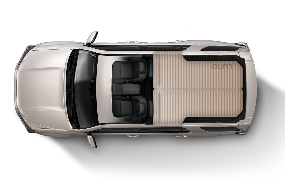 Top-down view of a silver SUV with a Luno mattress in the cargo area